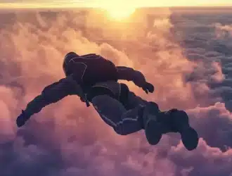 a skydiver gracefully free-falling through the clouds during an airdrop mission.